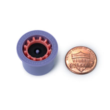 Purple alpenglow gear made in the usa purple and red fuel transfer device next to a U.S. penny on a white background