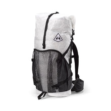 Hyperlite Mountain Gear's Ultralight backpack with a mesh center exterior pocket and two solid-fabric side exterior pockets, predominantly white with black straps and mesh.