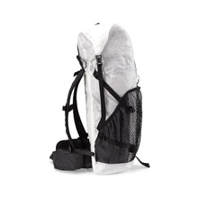 Hyperlite Mountain Gear's Ultralight backpack side view. Solid ripstop side pockets with a mesh center exterior pocket. There are large hip belt pockets.