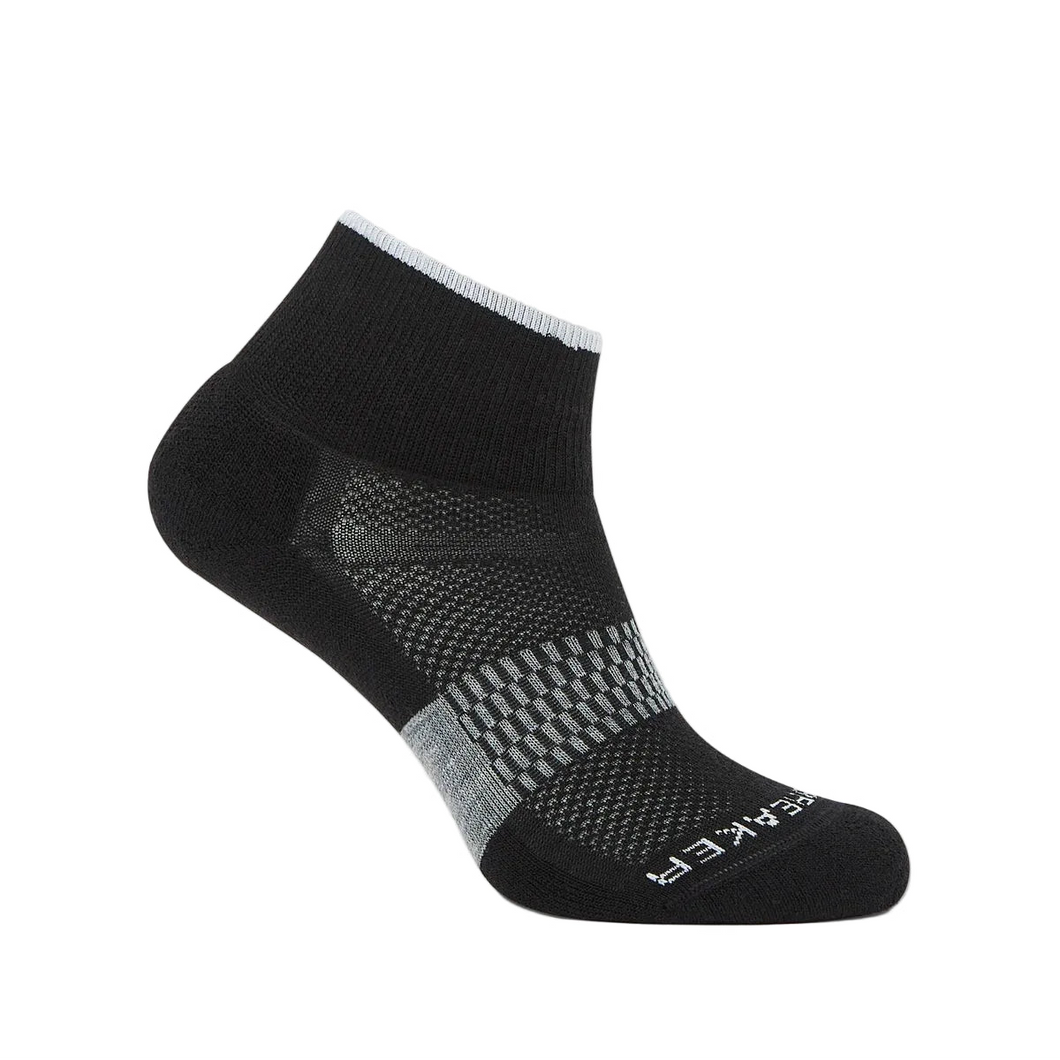 Icebreaker Women's Merino Wool Black sock with gray ribbing in the middle with ventilated fabric on top and icebreaker written across the top of the toe. 