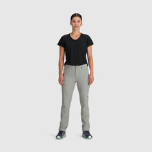 Woman wearing a black v-neck shirt with the Outdoor Research Women's Ferrosi Hiking Pants in light gray on a white background