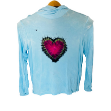 bamboo tie dye heart on a light blue shirt on a white background